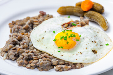 lentils with fried egg and pickled vegetables