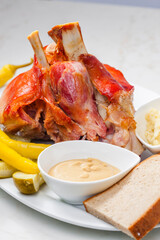 roasted pork knee with picked vegetables, bread and mustard