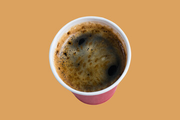 Coffee to go in a paper red glass without a lid on a terracotta background, top view, close-up