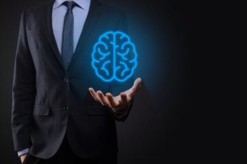 Businessman holding abstract brain and icon tools, device, customer network connection communication on virtual , innovative development future technology, science, innovation and business concept