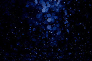 Glittering stars of blue bokeh