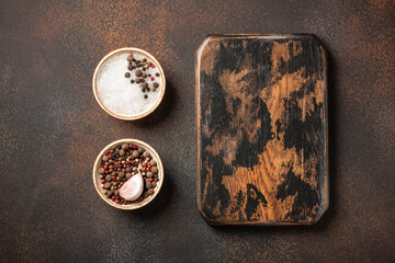 Cooking background with vintage cutting board and spices