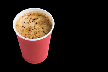 Coffee to go in a paper cup without a lid on a black background copy space top and side view