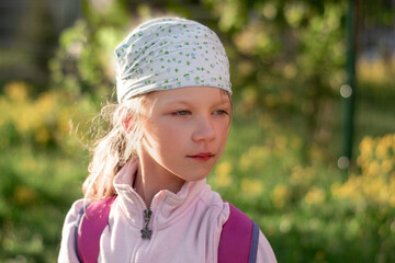 portrait of a six-year-old girl in a bandana