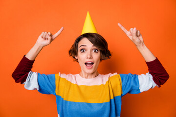 Portrait of impressed funky lady open mouth indicate fingers hat isolated on orange color background
