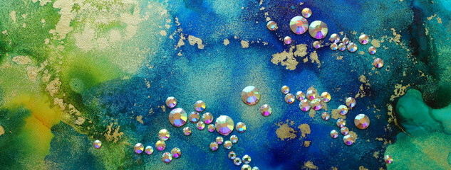 art photography of abstract fluid art painting with alcohol ink blue, green, gold colors and...