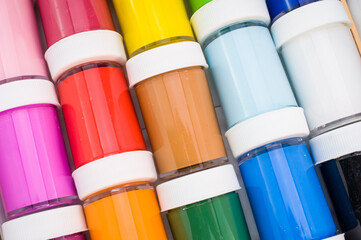 acrylic paint bottles full frame backdrop