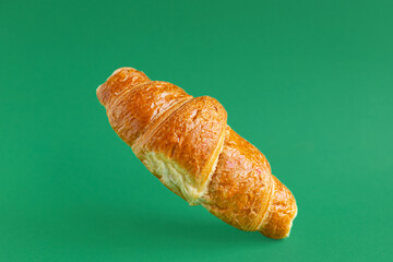 fresh croissant on colored background sweet bakery dessert bun snack healthy meal top view copy space for text rustic food background top view