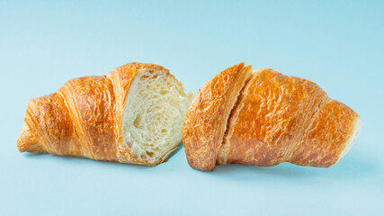 fresh croissant on colored background sweet bakery dessert bun snack healthy meal top view copy space for text rustic food background top view