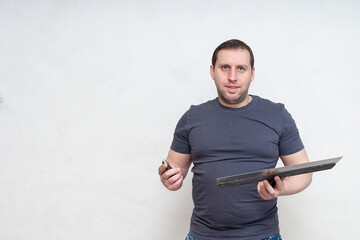 Male painter with a spatula in his hands