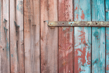 vintage background texture. old wooden panels fastened with a metal strip.
