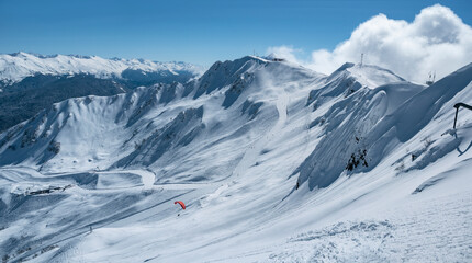 Fototapeta na wymiar Panoramic view of winter ski resort Gazprom Alpika in Krasnaya Polyana mountains (Russia)