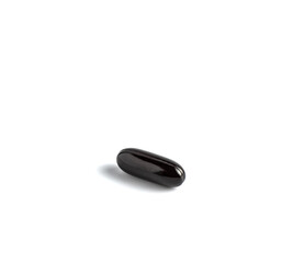 black pills on white background
