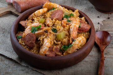 A classic dish of Cajun cuisine is jambalaya with shrimps and sausages. Selective focus.