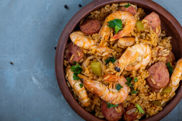 Local food jambalaya with shrimps, waffles and smoked sausages . A dish of Cajun cuisine. Top view....