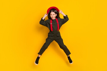 Fototapeta na wymiar Full length body size view of attractive cheerful funky girl jumping having fun isolated over bright yellow color background