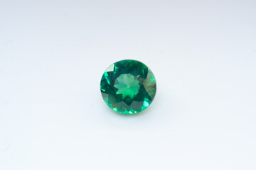 Natural gemstone green sapphire on white background