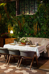 Tables served for special occasion, decorated with flower