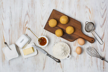 Honey cake preparing and ingredients flour, butter, eggs and honey
