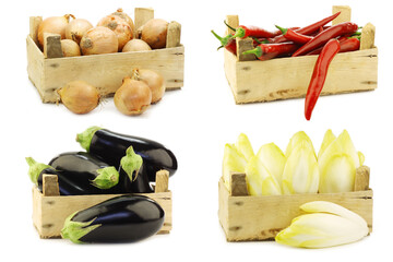 Freshly harvested cooking vegetables in wooden crate on a white background