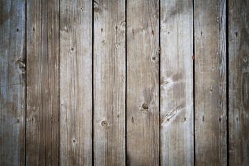Natural old wooden boards background. Dark grey textured vertical wood planks. Copy space, vignette.
