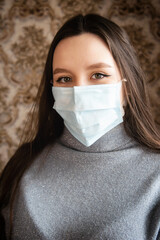 Young girl in a burst mask. Viral diseases and remedies. Prevention of pneumonia and influenza.