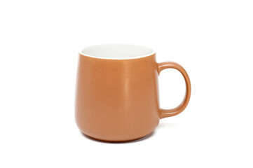 Brown mug for tea or coffee on a white background.