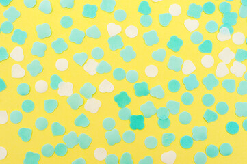 Abstract background in yellow color. Pieces of soap of different shapes on a yellow background 