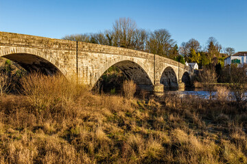The arched Ken Bridge over the Water of Ken on a sunny winters day, Scotland