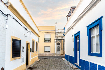 Small houses on the narrow street of historic Olhao, Algarve, Portugal