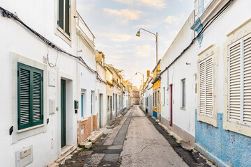 Fototapeta na wymiar Small houses on the narrow street of historic Olhao, Algarve, Portugal