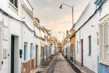 Fototapeta na wymiar Small houses on the narrow street of historic Olhao, Algarve, Portugal