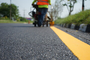 The officer was hitting a traffic line on a paved road.