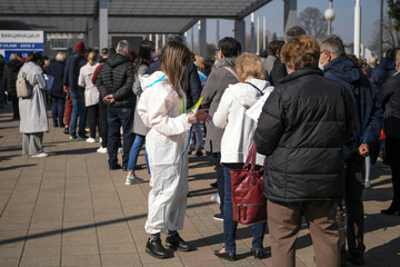 Mass vaccination. People from neighboring countries stand in long queues on Belgrade fair in front...