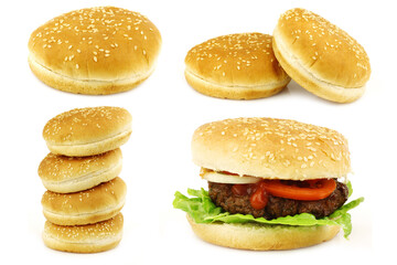 fresh homemade hamburger with lettuce, tomatoes, onions and sauce and some hamburger buns on a white background