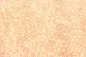Light yellow dirty cloth, covered with stains and streaks. Beige abstract texture.