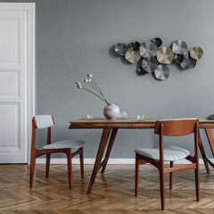 Modern dining room interior with glamour wooden oak table , stylish retro chairs and design...
