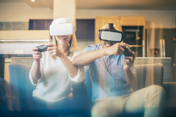 Woman and man playing VR games