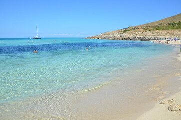 Insanely beautiful turquoise sea water. Beautiful summer sandy beach. Summer rest.