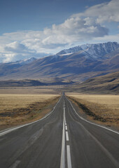 Empty Chuya Highway in Kurai Steppe, Altai Mountains, Siberia, Russia.