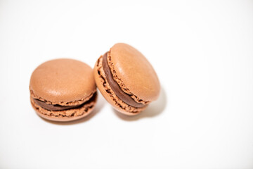 several multi-colored macaroon cakes on a white background