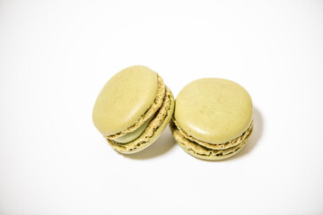 several multi-colored macaroon cakes on a white background