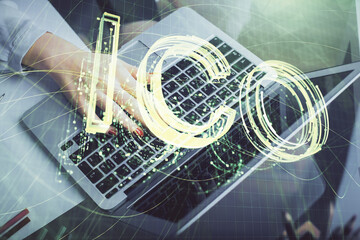Double exposure of woman hands typing on computer and crypto market theme hologram drawing....