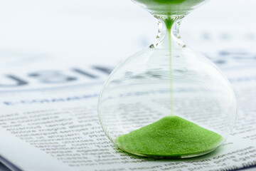 Time value of money, investment for sustainable wealth concept : Green sand clock / hourglass timer...