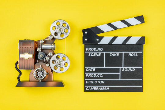 Film projector, movie shooting gear, clapperboard that used in filmmaking and video production to assist in synchronizing of picture and audio or sound, to designate and mark various scenes and takes
