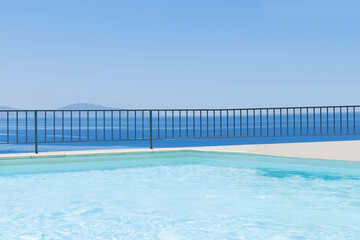 Fototapeta na wymiar Luxury house with infinity pool over the ocean.