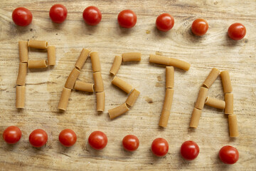 composition with pasta and cherry tomatoes