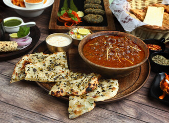 The Indian traditional food Chhole Kulchha or kulcha, Black-Olive & Jalapeno Kultcha Amritsari Chole. selective focus