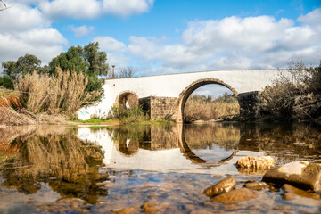 Roman bridge over a small river in Loule, Algarve, Portugal