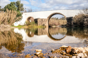 Fototapeta premium Roman bridge over a small river in Loule, Algarve, Portugal